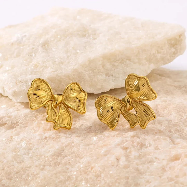 Feminine gold bow jewelry – stainless steel earrings for women with shine